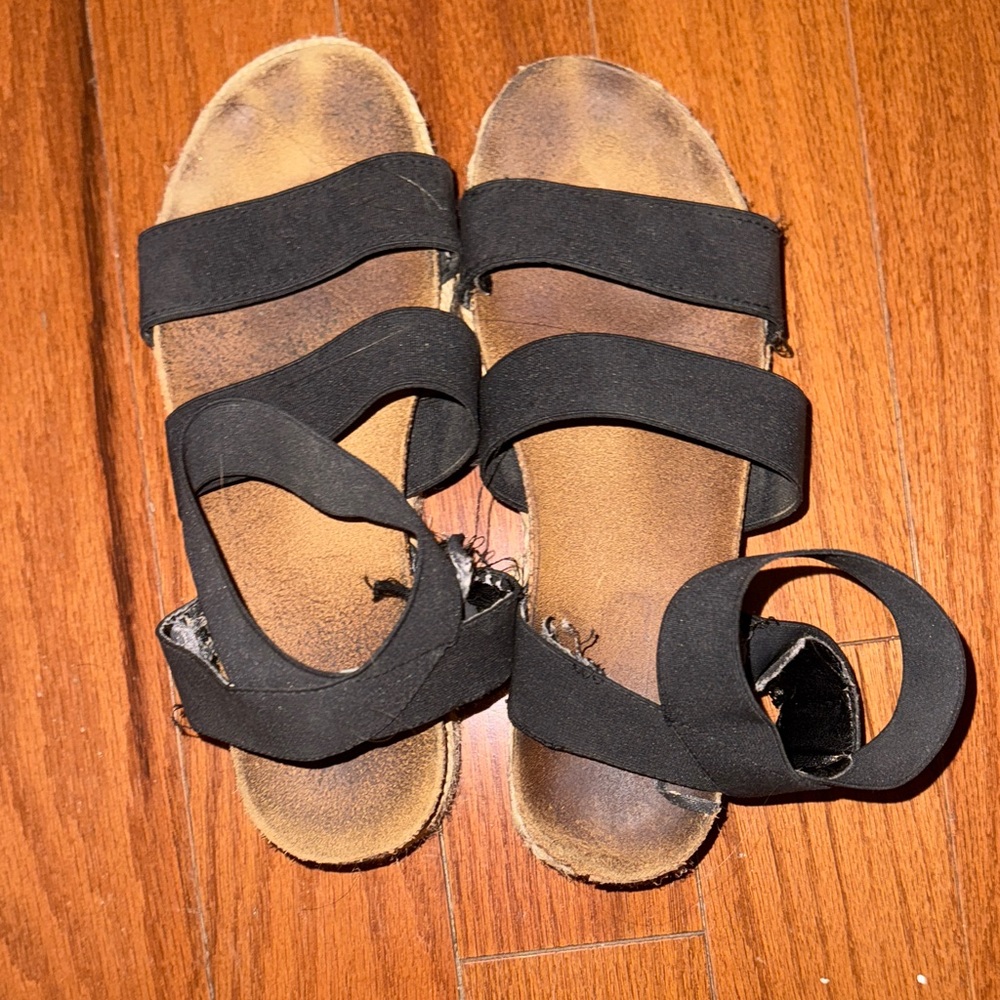 Worn Black Sandals